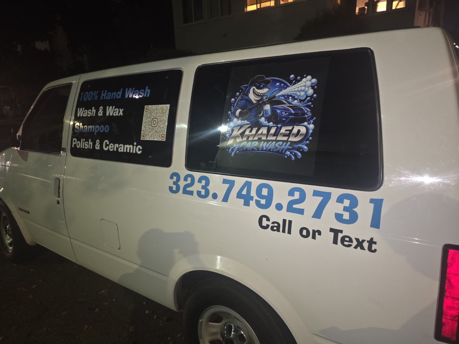 Car wash commercial decals installed on a white van